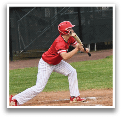 A baseball player in a red shirt and white pants is swinging a bat. Description generated by AI