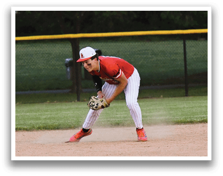 A baseball player in a red shirt and white pants is catching a ball. Description generated by AI