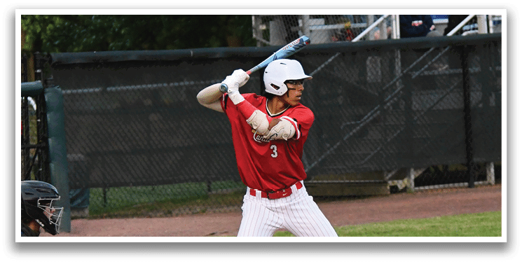 A baseball player is swinging a bat on a field. Description generated by AI
