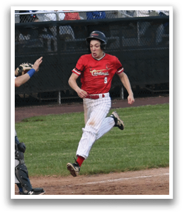 A baseball player running to first base. Description generated by AI