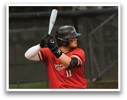 A baseball player in a red shirt and white pants is swinging a bat. Description generated by AI