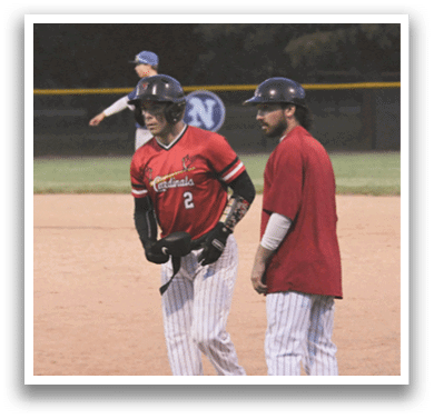 A baseball player wearing a blue shirt and white pants. Description generated by AI