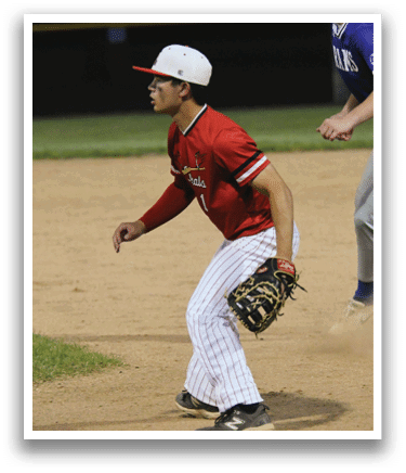 A baseball player wearing a red shirt and white pants. Description generated by AI