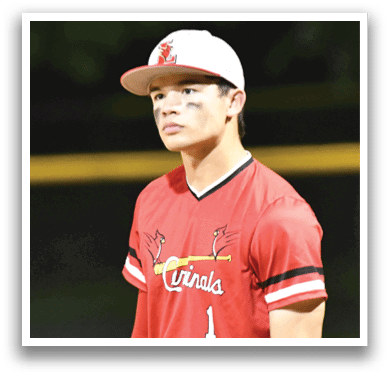 A baseball player wearing a red and white jersey with the number 1 on it. Description generated by AI