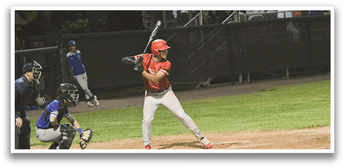 A baseball player in a red shirt and white pants is swinging a bat. Description generated by AI