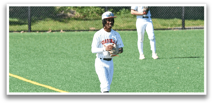 A baseball player wearing a white and red uniform. Description generated by AI