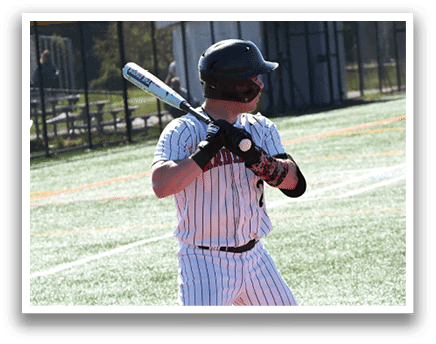 A baseball player holding a bat. Description generated by AI