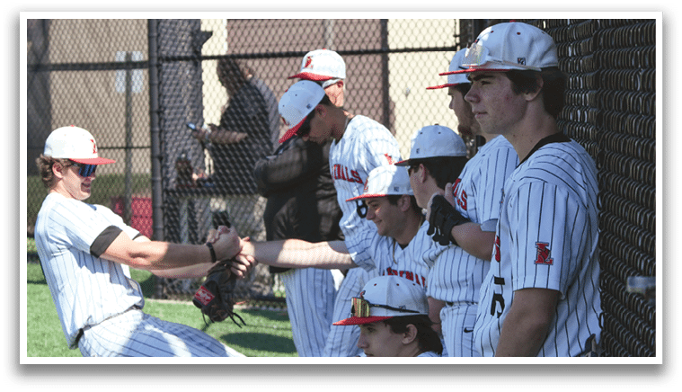 A group of baseball players sitting on a bench. Description generated by AI