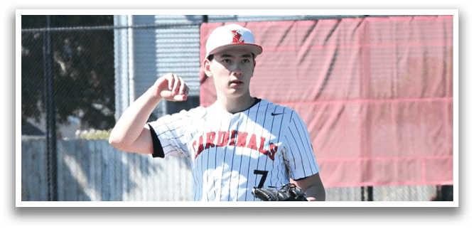 A baseball player in a white and black uniform stands on a baseball field. Description generated by AI