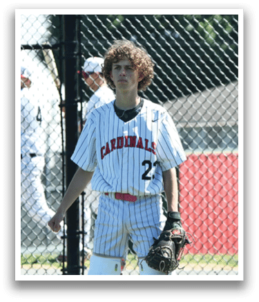 A baseball player wearing a white and red striped shirt and white pants. Description generated by AI