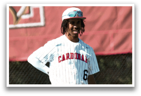 A man wearing a Cardinals baseball uniform. Description generated by AI