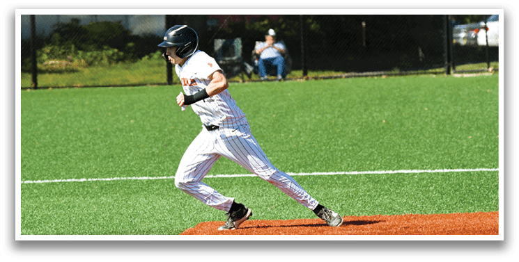 A baseball player running to a base. Description generated by AI