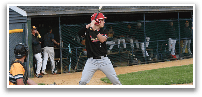 A baseball player is swinging a bat at a ball. Description generated by AI