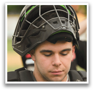 A man wearing a baseball helmet. Description generated by AI