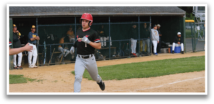 A baseball player running to a base. Description generated by AI