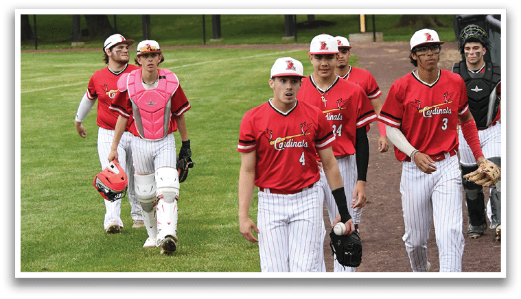 Baseball players walking on a field. Description generated by AI