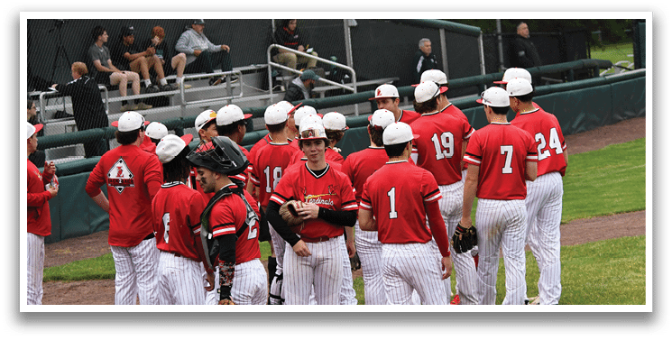 A group of baseball players wearing red shirts and white pants. Description generated by AI