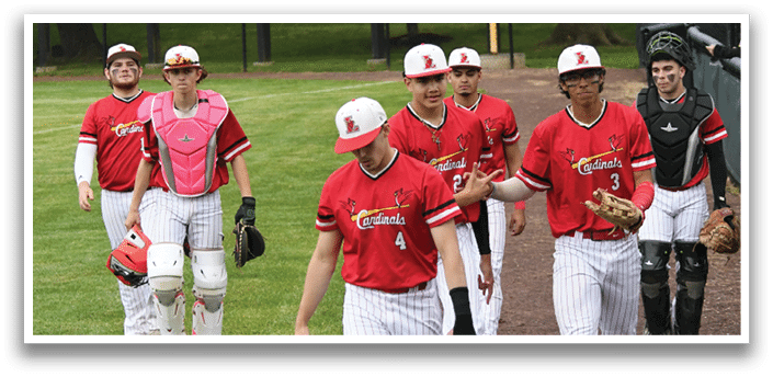 Baseball players walking on a field. Description generated by AI