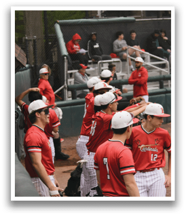 Baseball players wearing red and white uniforms. Description generated by AI