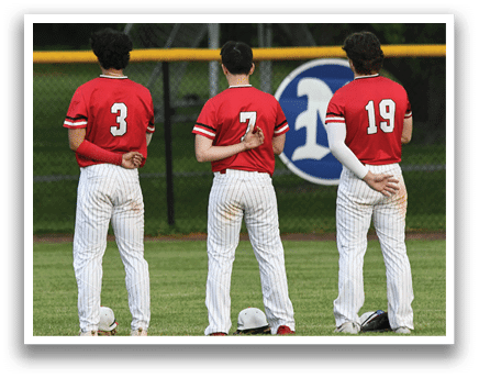 Three baseball players standing on a field. Description generated by AI