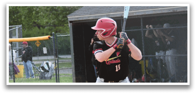 A baseball player in a black and red jersey is holding a bat and getting ready to swing. Description generated by AI