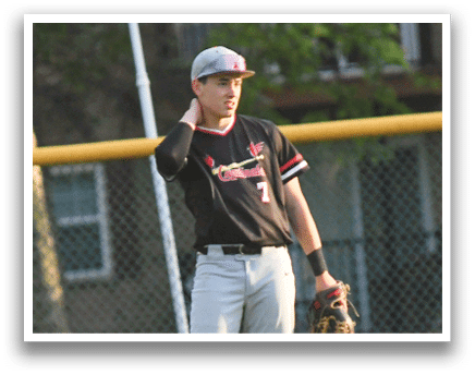 A baseball player wearing a black and red shirt and red shoes. Description generated by AI