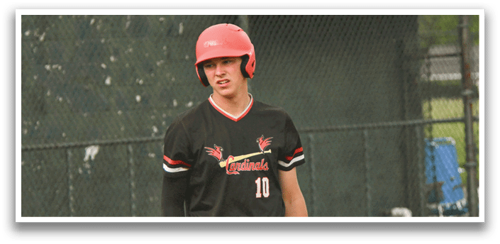 A baseball player wearing a red helmet and black jersey. Description generated by AI