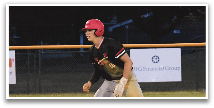 A baseball player wearing a red helmet and black shirt. Description generated by AI