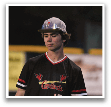 A man wearing a black and red jersey with the number 15 on it. Description generated by AI