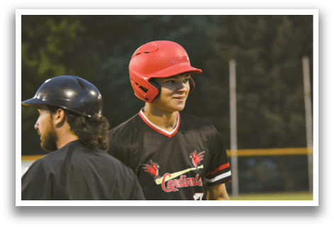 A baseball player wearing a red helmet. Description generated by AI