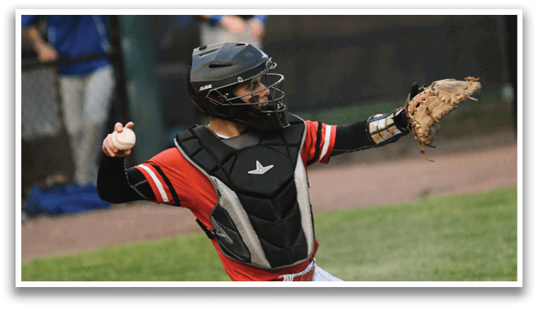A baseball player wearing a black and red helmet and catcher's mitt. Description generated by AI
