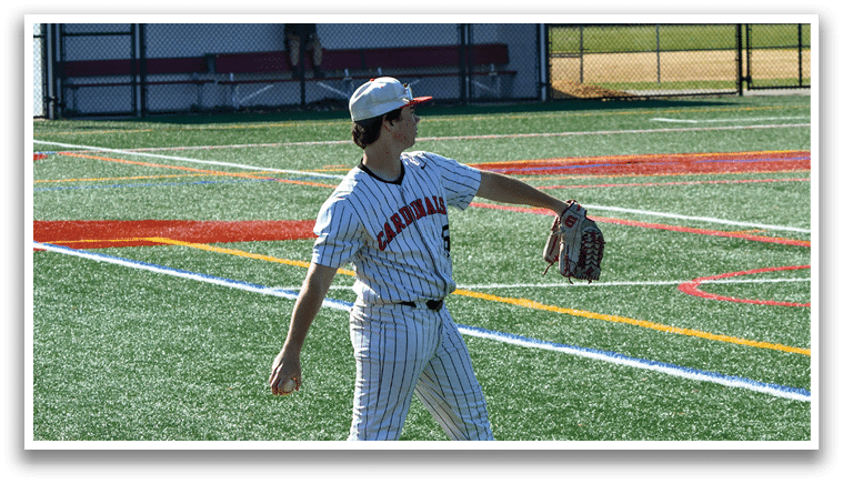 A baseball player in a white and red uniform is throwing a ball. Description generated by AI