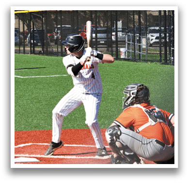 A baseball player is swinging a bat at a ball. Description generated by AI