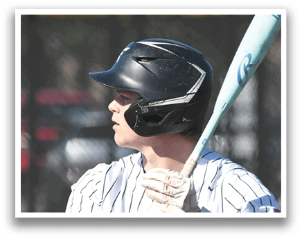 A baseball player wearing a black helmet and holding a bat. Description generated by AI