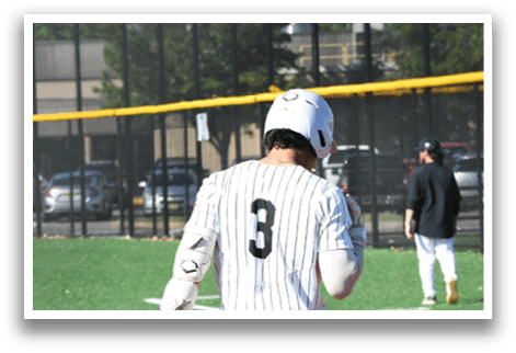 A baseball player wearing a white and red uniform with the number 3 on the back. Description generated by AI