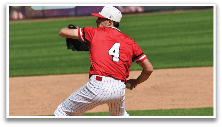 A baseball player wearing a red and white uniform and red socks. Description generated by AI