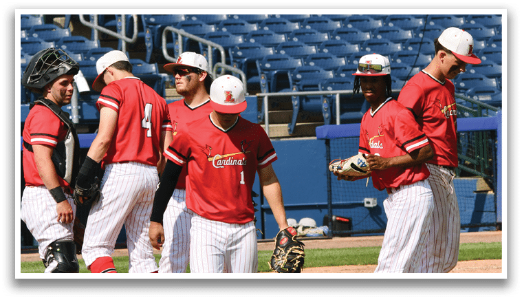 A group of baseball players wearing red jerseys. Description generated by AI