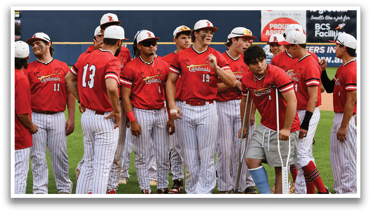 A group of baseball players standing on a field. Description generated by AI