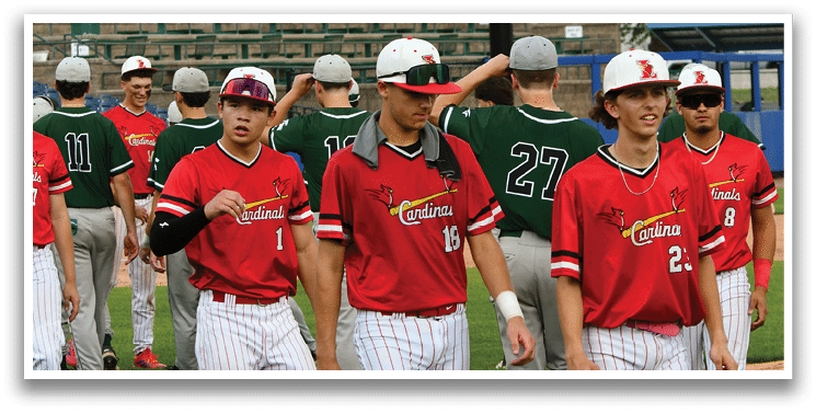 A group of baseball players walking on a field. Description generated by AI