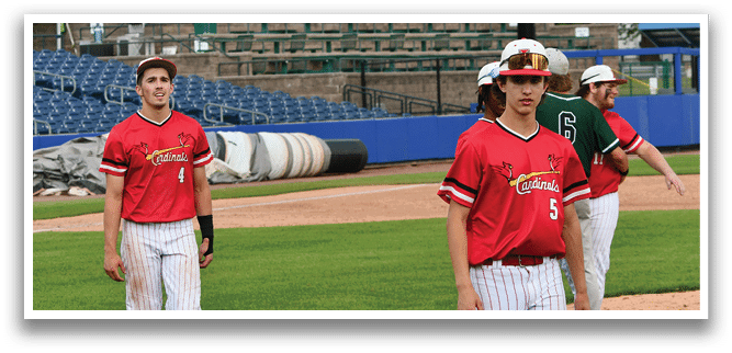 A baseball player wearing a red jersey with the number 4 on it. Description generated by AI