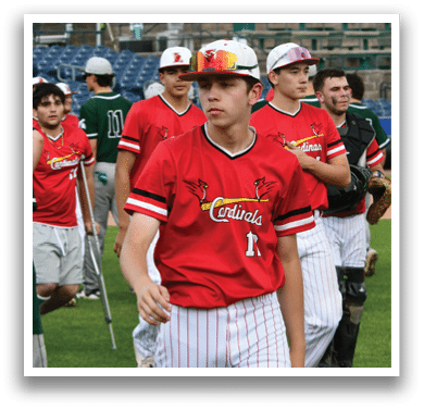 A man wearing a red shirt with the number 1 on it. Description generated by AI