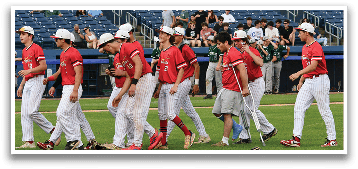 A group of baseball players wearing black and red uniforms. Description generated by AI