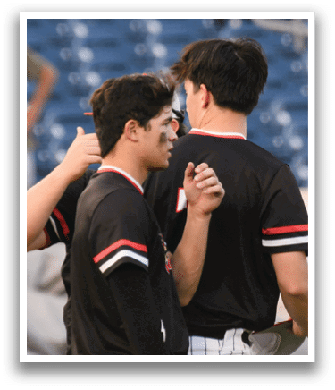 Two men wearing black shirts and white pants. Description generated by AI