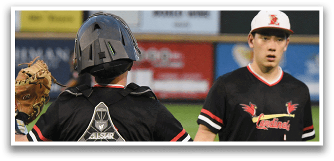 A baseball player wearing a black shirt with the number 2 on it. Description generated by AI