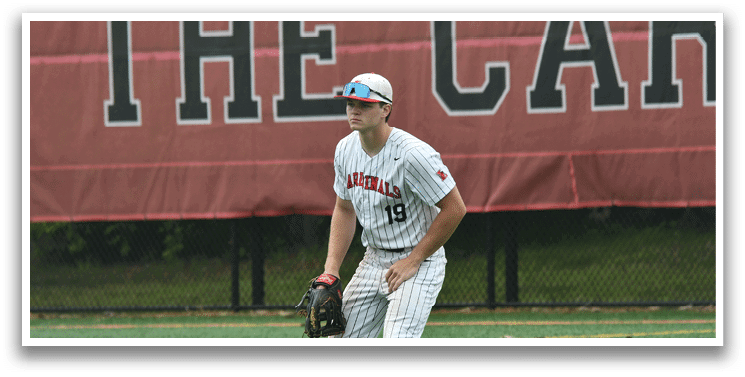 A baseball player wearing a white hat and a red and white uniform. Description generated by AI