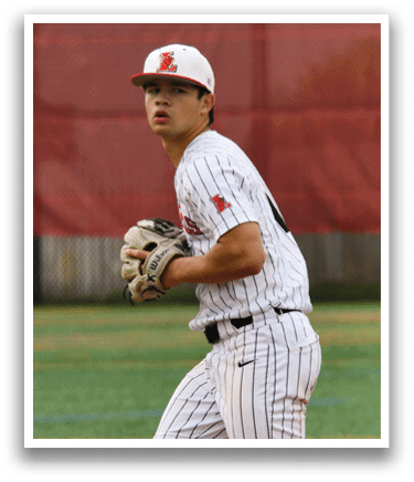 A baseball player in a white and black uniform is on the field. Description generated by AI