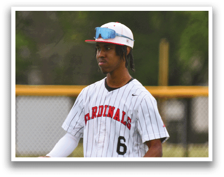 A baseball player wearing a Cardinals jersey. Description generated by AI