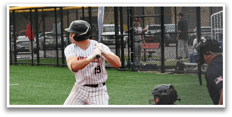 A baseball player is swinging a bat at a ball. Description generated by AI