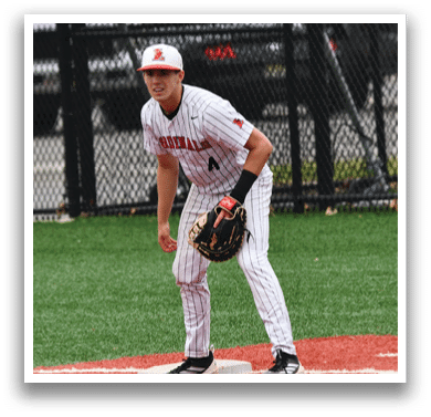 A baseball player is standing on a base. Description generated by AI