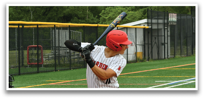 A baseball player in a red helmet and black and white uniform is swinging a bat. Description generated by AI